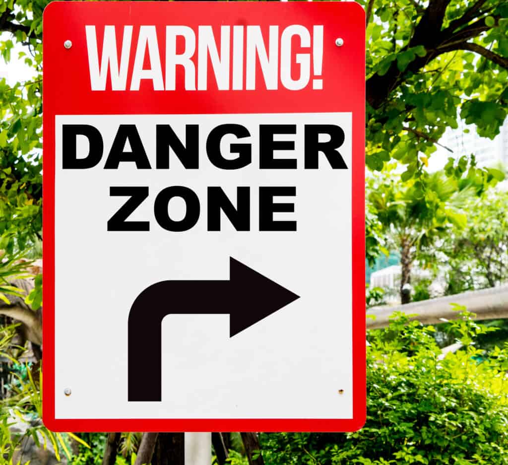Sign with arrow warning of danger
