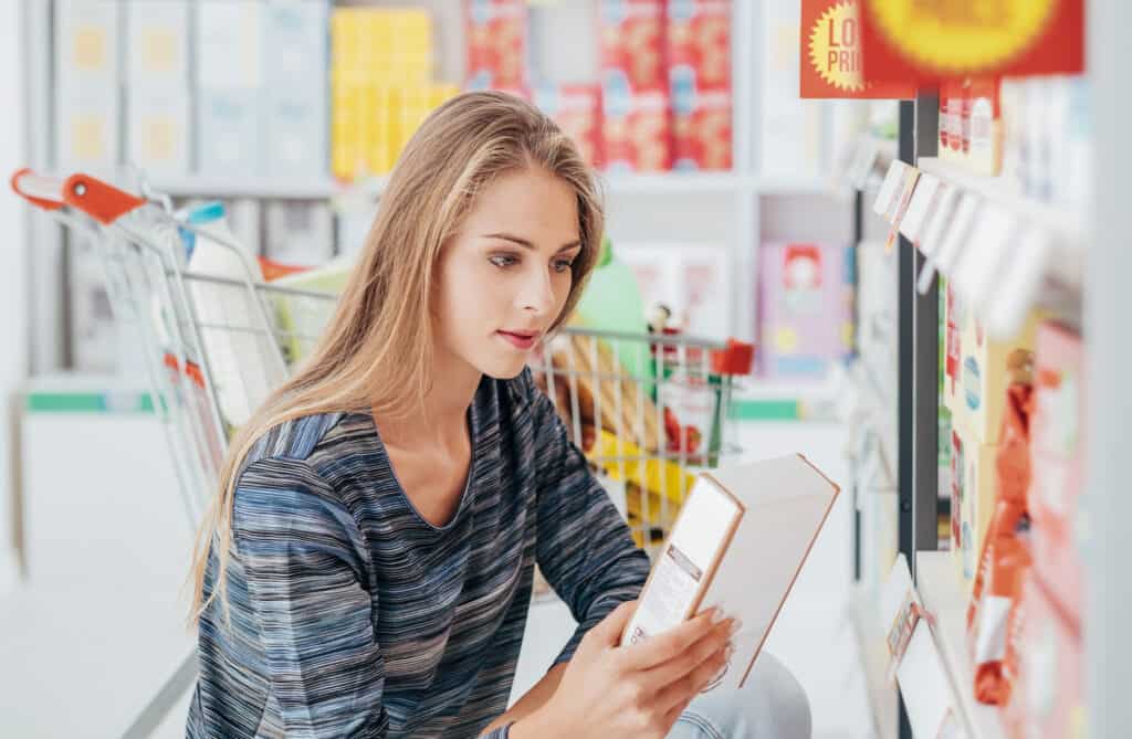 Woman reading food label